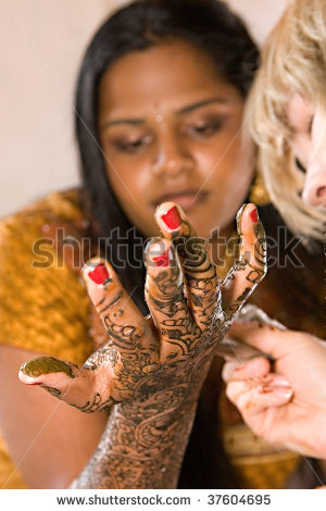 stock-photo-a-young-hindu-bride-receives-traditional-henna-designs-on-her-arms-and-hands-37604695